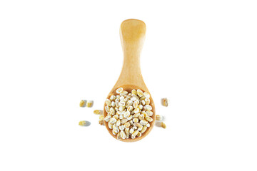 Wooden spoon with pearl barley isolated on white background.