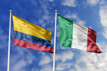 Colombia and Italy flags gracefully flying together against a bright blue sky, symbolizing...