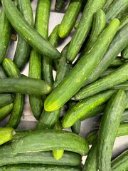 Fresh cucumbers on market stall