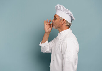 professional chef kisses his hands.