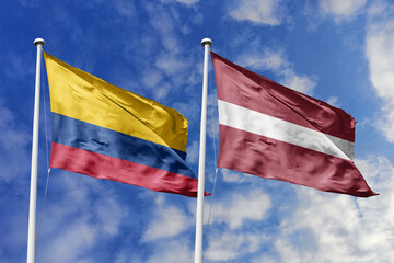 Colombian and Latvian flags proudly wave together, symbolizing international relations, friendship, and cultural exchange.