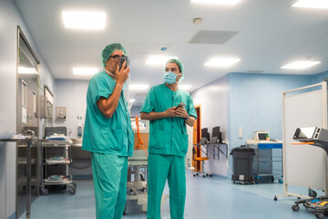 Surgeons using smartphones in operating area