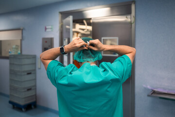 Surgeon adjusting cap before surgery
