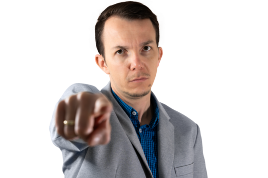 Serious businessman in grey suit with intense facial expression pointing finger directly at viewer, symbolizing demand for attention or authority. Isolated portrait. Transparent png