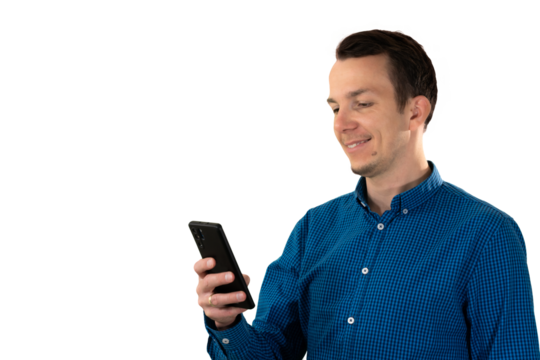Man looking at smartphone with slight smile, suggesting reading a message, engaging with content, or positive mobile interaction. Isolated portrait. Transparent png