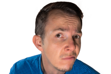 Man in blue shirt with suspicious facial expression glancing upward, conveying doubt or disbelief useful in expressive communication themes. Isolated portrait. Transparent png