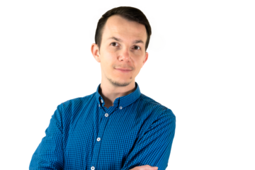 Calm confident man with arms crossed and gentle smile in studio portrait, symbolizing self-assurance, professionalism, and personal branding. Isolated portrait. Transparent png