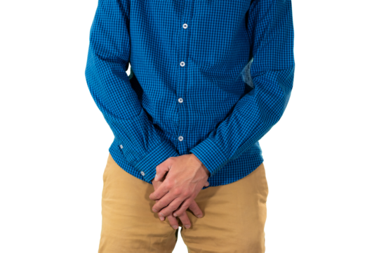 Man covering groin area with hands in protective manner suggesting discomfort, pain or reaction to sensitive situation. Isolated. Transparent png