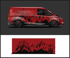Red van with a striking mountain range graphic wrap design © MdAbdullah