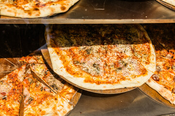 Classic cheese pizza fresh from the oven with golden crust and melted toppings. Italian fast food, casual dining and comfort eating for everyday indulgence.