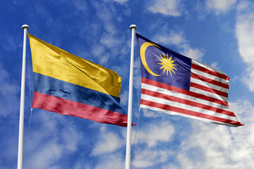 Colombian and Malaysian flags proudly wave together, symbolizing international relations,...