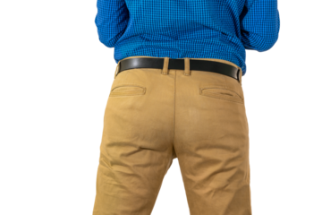 Backside view of male in tan pants and blue shirt with hands on waist, neutral stance. Isolated. Transparent png