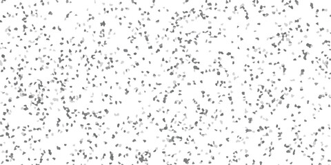 Naklejka premium Abstract gray mosaic of small tessellated shapes scattered across a white background with a subtle gradient of varying tones and textures.