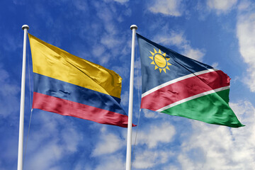 Colombian and Namibian flags proudly wave together, symbolizing international relations, friendship, and cultural exchange.