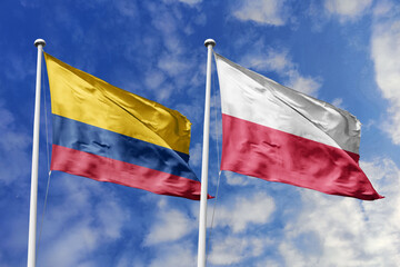 Colombian and Polish flags proudly wave together, symbolizing international relations, friendship,...