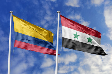 Waving flags of Colombia and Syria against a vibrant blue sky, symbolizing international relations and friendship.