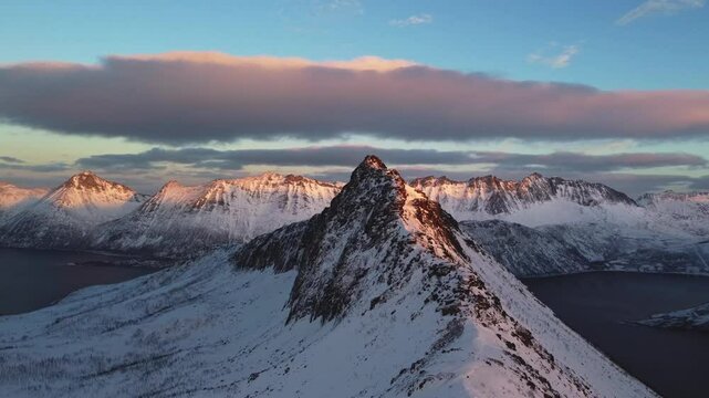 Breathtaking sunset view from Mount Segla on the Senja Peninsula in Northern Norway. A winter scene during the polar night