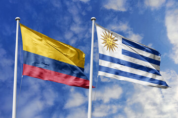 The Vibrant Flags of Colombia and Uruguay Waving Together Under a Bright Blue Sky, Symbolizing South American Unity, Diplomatic Ties, and Shared Cultural Heritage.