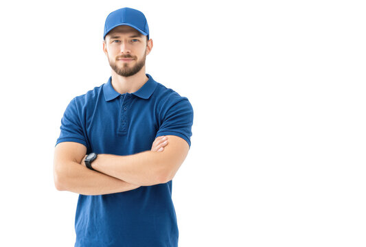 Confident young man in a blue polo shirt and cap stands with arms crossed against a plain white background. conveying professionalism and approachability. ideal for service industry promotions