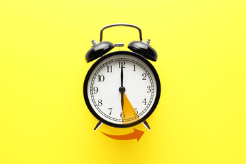Alarm clock on color background