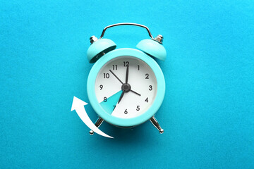 Alarm clock on color background