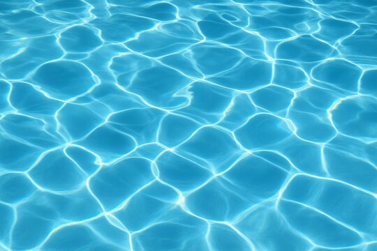 Closeup of blue pool water with sunlight reflections Calming ripples create abstract surface pattern