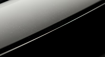 Microscopic Dust Particles on a Sleek, Two-Tone Surface