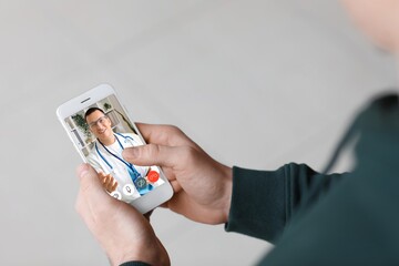 Man video chatting with doctor, closeup. Concept of telemedicine