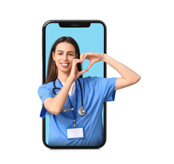 Young female doctor making heart gesture on blue background