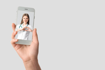 Female hand with mobile phone on white background