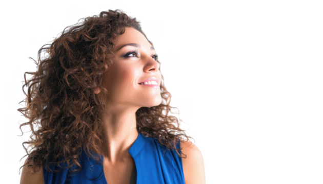 A young woman with curly hair wearing a blue top smiles while looking up. set against a plain white background. conveying a sense of positivity and hopefulness
