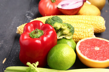 Fresh ripe vegetables on dark wooden background, closeup
