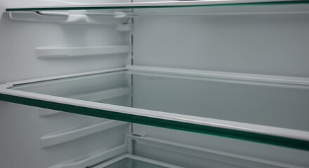Empty Refrigerator Interior with Glass Shelves, Clean and Modern Design