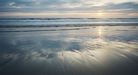 Serene Sunset Beachscape: Rippled Sands Reflecting Golden Hour Glow