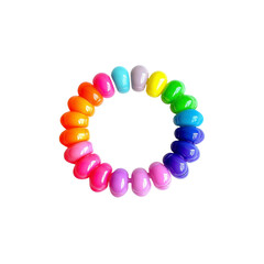 Obraz premium Rainbow Spiral Hair Tie on Black Background