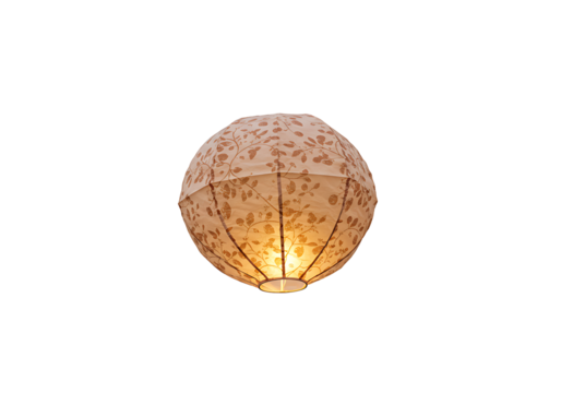 Glowing round lantern with floral patterns against a black background