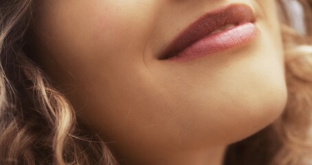 Close-up of a woman's smile and lips.
