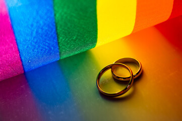 Wedding rings and rainbow light. 