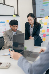 Entrepreneur in suit brainstorming about marketing strategy in company conference room. Brainstorming about business group project analysis plan. Vertical image.