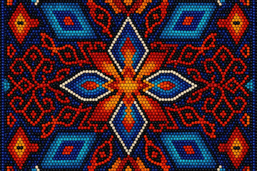Vibrant abstract Huichol beadwork design features intricate patterns in bright orange, blue, and white, resembling a traditional textile or beadwork, creating a lively and dynamic visual experience