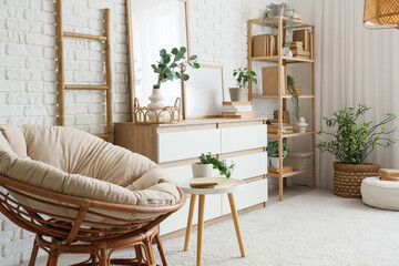 Bookcase, chest of drawers, sofa and armchair in modern interior of room