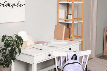 Student's workplace with notebooks and laptop in room