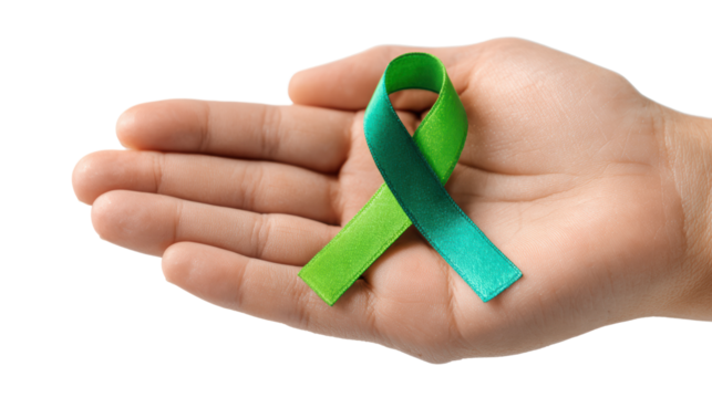 A hand holding a green and teal awareness ribbon on a white isolated background.