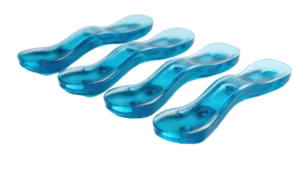 Set of four blue silicone shoe insoles on a white isolated background.