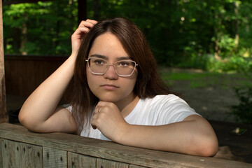 Portrait of young attractive woman in eyeglasses	