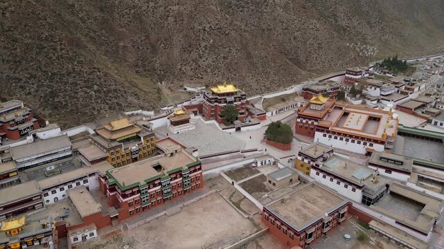 Xiahe, China: Aerial drone footage of ancient temples in the Tibetan Buddhism Labrang Monastery in the Xiahe town on the Tibetan plateau.
