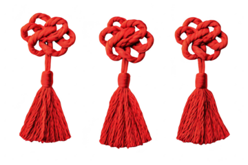 Three red chinese knots with tassels isolated on transparent background
