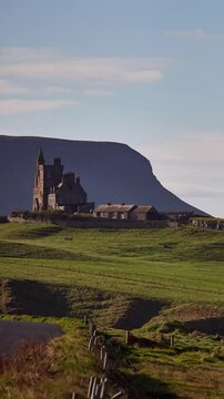 Vertical view of Classiebawn Castle with Benbulben mountain in the background, County Sligo, Ireland