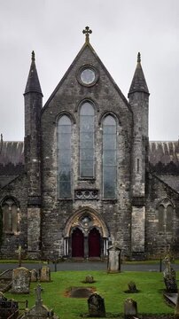 St. Canice's Cathedral in Kilkenny, Ireland, with Gothic architecture and ancient graveyard in autumn