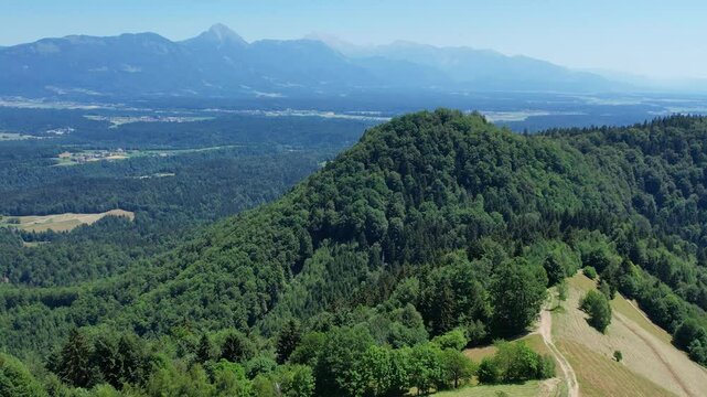 Aerial morning view of St. Primoz church at Jamnik, Slovenia, Julian alps.